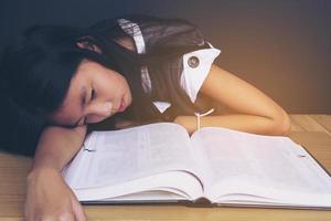 A girl is unhappy reading book photo