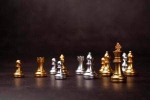 Golden Chess King standing to Be around of other chess, Concept of a leader must have courage and challenge in the competition, leadership and business vision for a win in business games