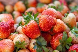 Pile of fresh strawberries for sale in the fresh market photo