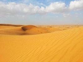 Sand dunes in the desert photo