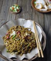 fry indonesian noodle close up with vegetable photo