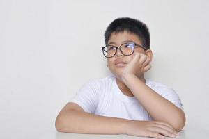 Asian boy thinking contemplating and decided. photo