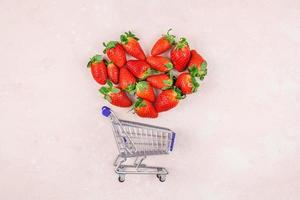 Shopping concept composition with strawberries photo