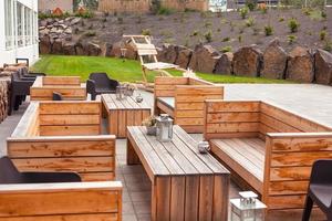 Outdoor restaurant terrace with wooden furniture photo