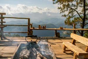 Old kettle heating on firewood stove photo