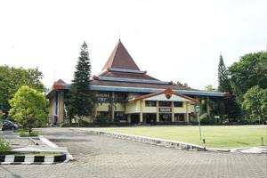 SOLO, INDONESIA , 2022 - university sebelas maret. rectorate building construction in the middle of a beautiful garden photo