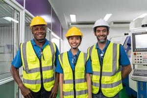 Portrait of team worker labor with machine in factory plant. photo
