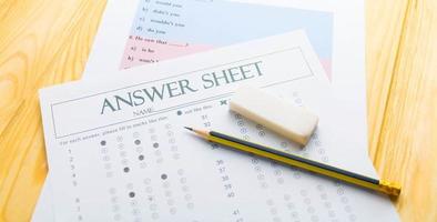 pencil on answer sheet and question sheet photo