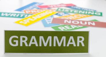 green grammar card on white table photo