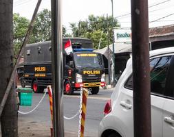 Tulungagung, Jawa timur, Indonesia, 2022 - police truck passing on the highway photo