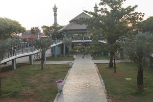 Gresik, Jawa timur, Indonesia, 2022 - view of the square of greek from a distance with the view of the cuban mosque in front of it photo