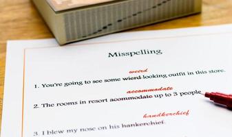 english spelling correction sheet on table photo