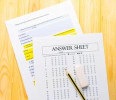 pencil on answer sheet and question sheet photo