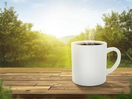 Hot coffee cup with on the wooden table and the plantations background with copy space photo