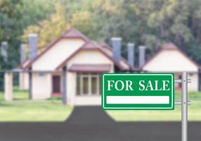 Home For Sale with green for sale sign photo