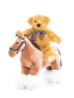 Teddy bear riding a horse photo