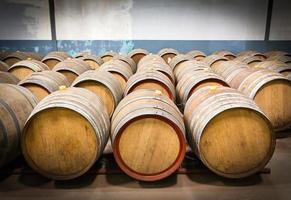 Wine barrels in the cellar of the winery photo