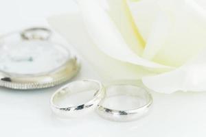 Wedding rings on white background photo