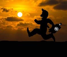 Cartoon Business silhouette concept,Businessman running on the way to success with briefcase at sunset photo