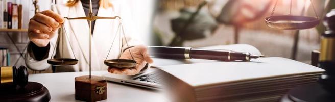 Business and lawyers discussing contract papers with brass scale on desk in office. Law, legal services, advice, justice and law concept picture with film grain effect photo