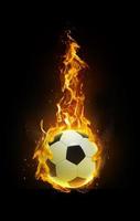 Soccer ball, fire in hand black background photo