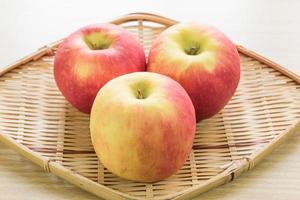 Red apple in basket photo