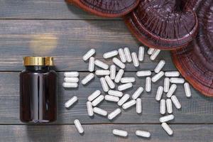 Ganoderma lucidum mushroom and capsule with bottle mockup photo
