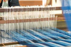 Weave silk cotton on the manual wood loom photo