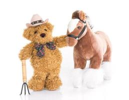 Teddy bear farmer with pitchfork and horse photo