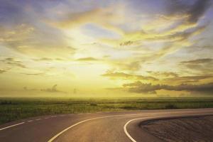 beautiful alphalt road and field at countryside photo