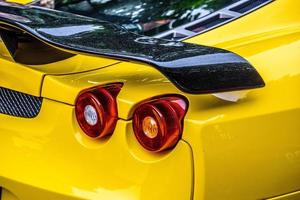 GERMANY, FULDA - JUL 2019 rearview lights of yellow FERRARI F430 Type F131 cabrio is a sports car produced by the Italian automobile manufacturer Ferrari from 2004 to 2009 as a successor to the Ferrar photo