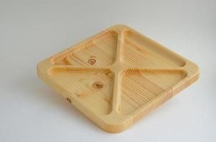 Portioned wooden yin yang dish on a gray background. Empty plate or tray, top view. combination plate photo