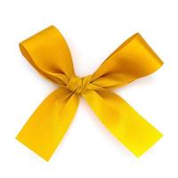 Golden ribbon bow isolated on white background photo