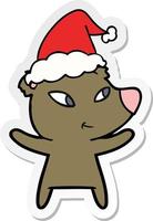 cute sticker cartoon of a bear wearing santa hat vector