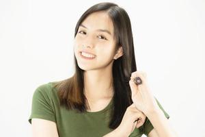 Young beautiful lady happy using comb to straight her hair - woman beauty hair care concept photo