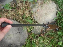 Folding air rifle for firing bullets photo