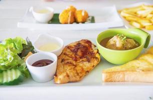 Fish pork and chicken steak meal set - clean fresh food on table concept photo