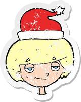 retro distressed sticker of a cartoon boy in santa hat vector