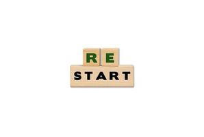 Restart symbol on wooden cubes. Business restart with copy space. photo