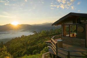 Wooden house on the top of the mountain in thailand photo
