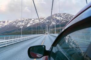 Driving on the Norway, road trip journey, travelling by car. Moving on the bridge.