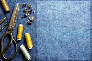 Background sewing equipment of jeans clothes table top view and  empty space for text photo