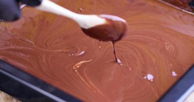 mixing hot chocolate during its preparation photo