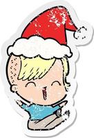 distressed sticker cartoon of a happy hipster girl wearing santa hat vector