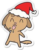 Linda pegatina de dibujos animados de un perro con gorro de Papá Noel vector