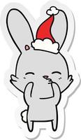 curious bunny sticker cartoon of a wearing santa hat vector