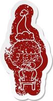 cartoon distressed sticker of a shocked man wearing santa hat vector