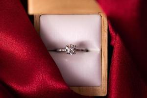 Diamond Wedding Ring Red Fabric photo