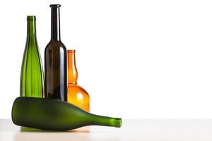 empty bottles on table with cutout background photo