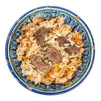 top view of plov in traditional ceramic bowl photo